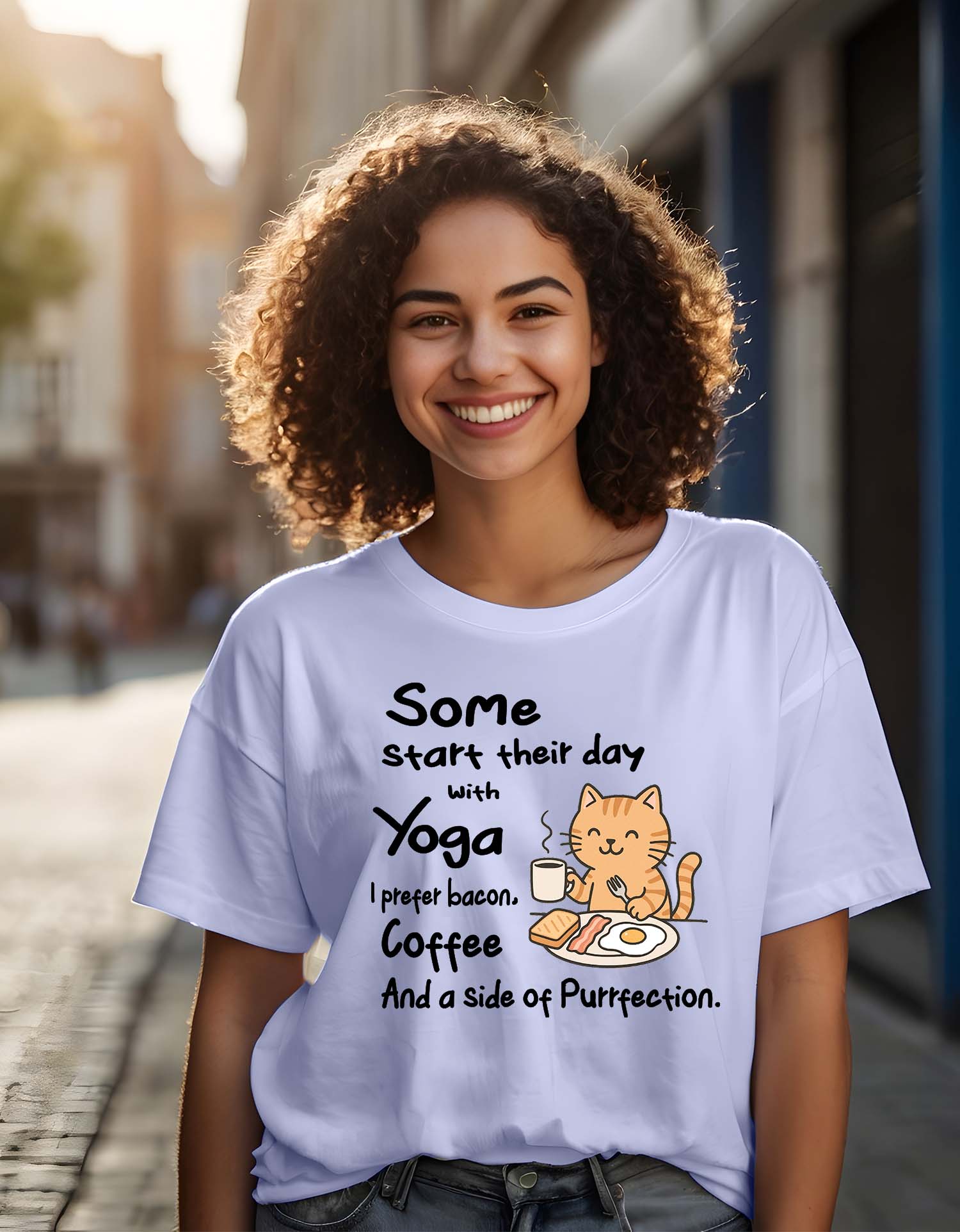 Person wearing a Dumkee Oversize white t-shirt with a humorous cat graphic and text on a city street.