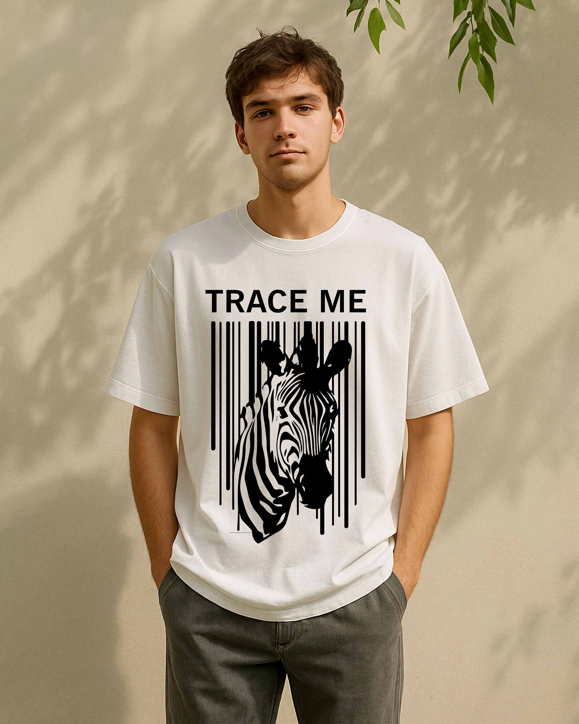 Person wearing a Dumkee Oversize white t-shirt with a zebra graphic and 'TRACE ME'