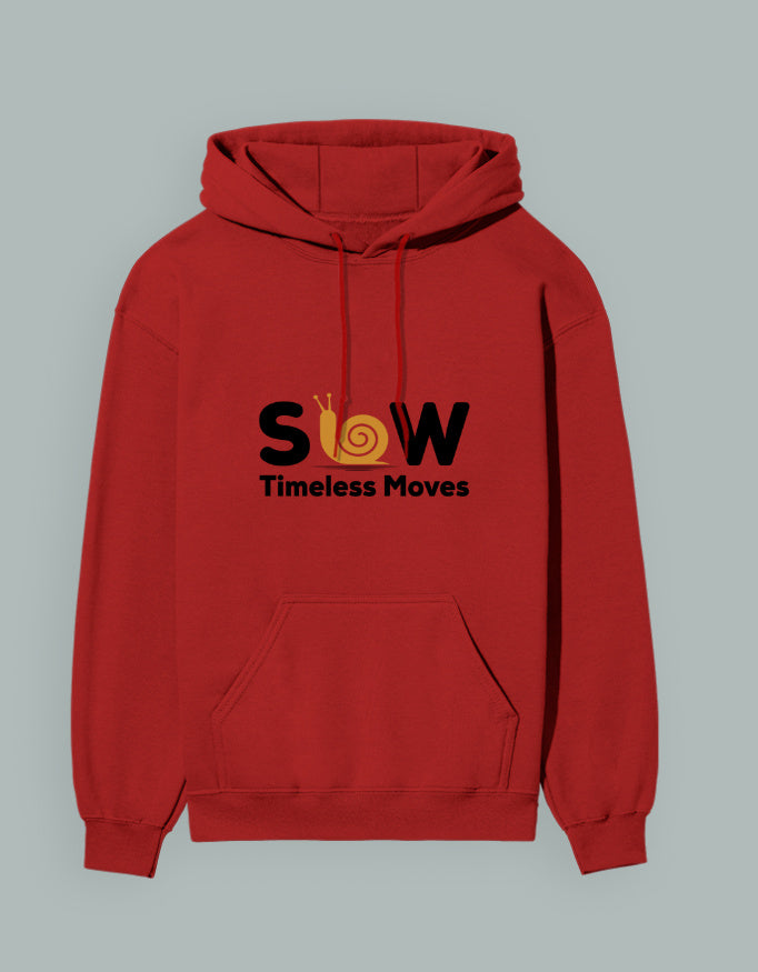 Person wearing a Dumkee Oversize red hoodie with 'SLOW Timeless Loves' text on a beige background