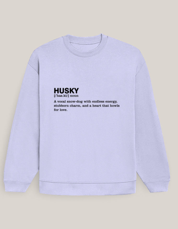 Man wearing a Dumkee Oversize light blue sweatshirt with text on a city street
