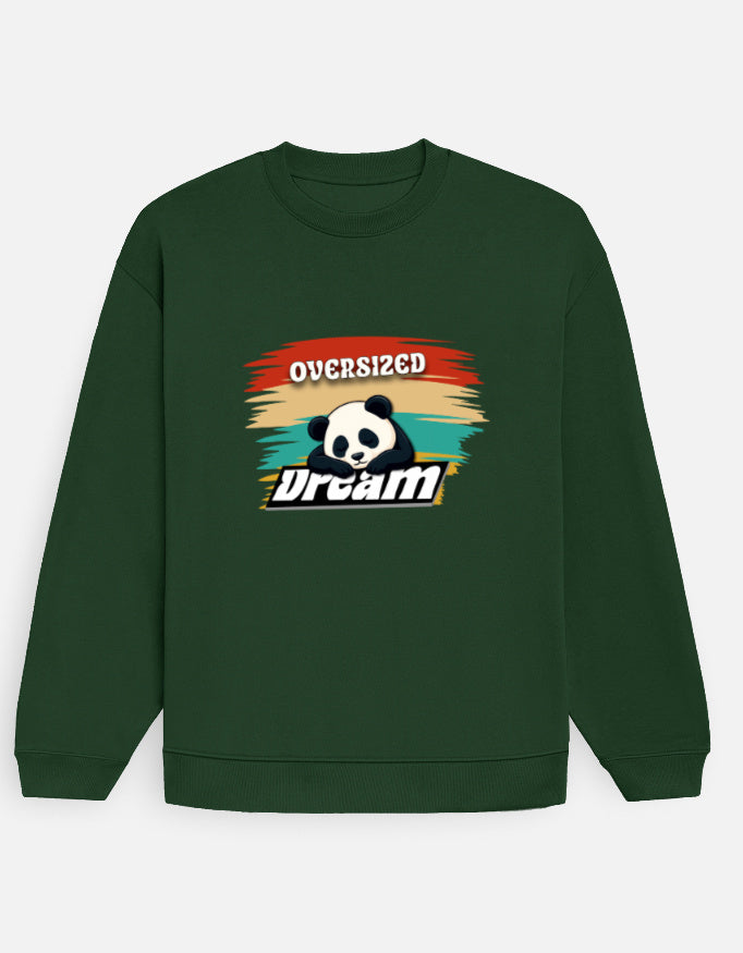 Person wearing a Dumkee Oversize green sweatshirt with a graphic design on a plain background