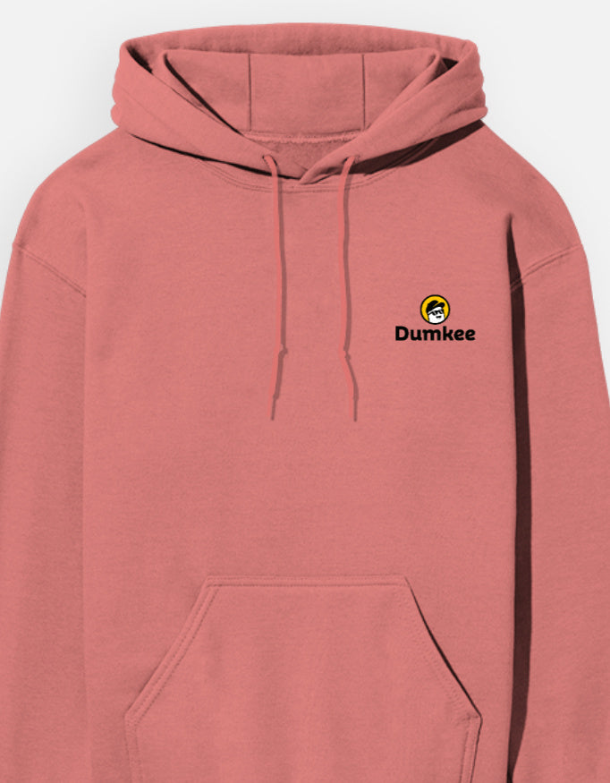 Person wearing a Dumkee pink hoodie with a logo on a gray background