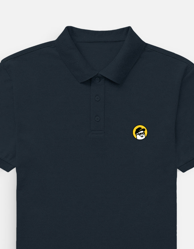 Man wearing a Dumkee  navy polo shirt with a logo