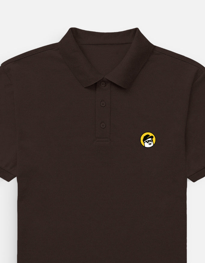 Person wearing a  brown polo shirt with a logo