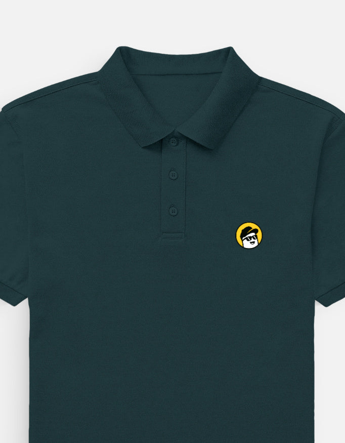 Man wearing a Dumkee  dark green polo shirt with a small yellow logo