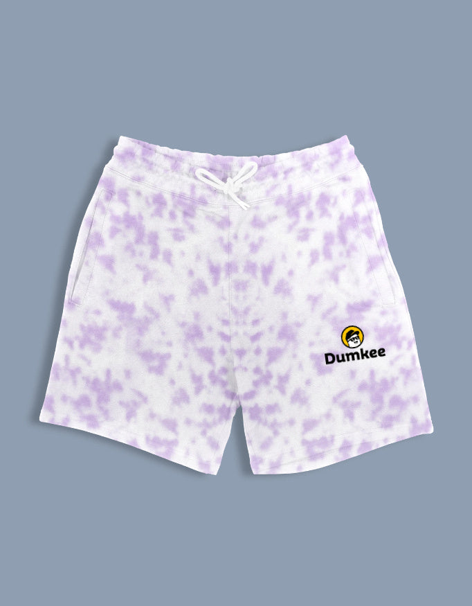 Purple patterned shorts with Dumkee logo on a gray background
