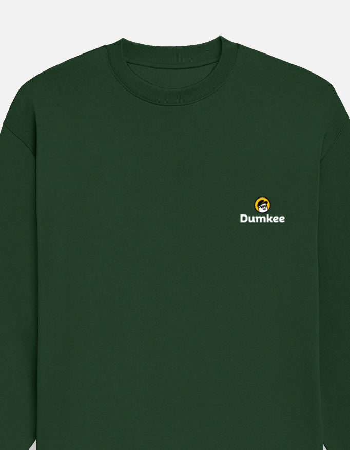 Person wearing a Dumkee  bottle green sweatshirt with Dumkee logo.