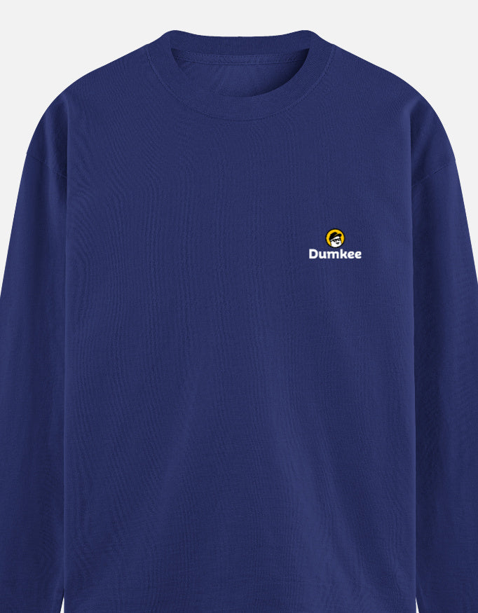 Man wearing a Dumkee blue long-sleeve shirt with a logo.