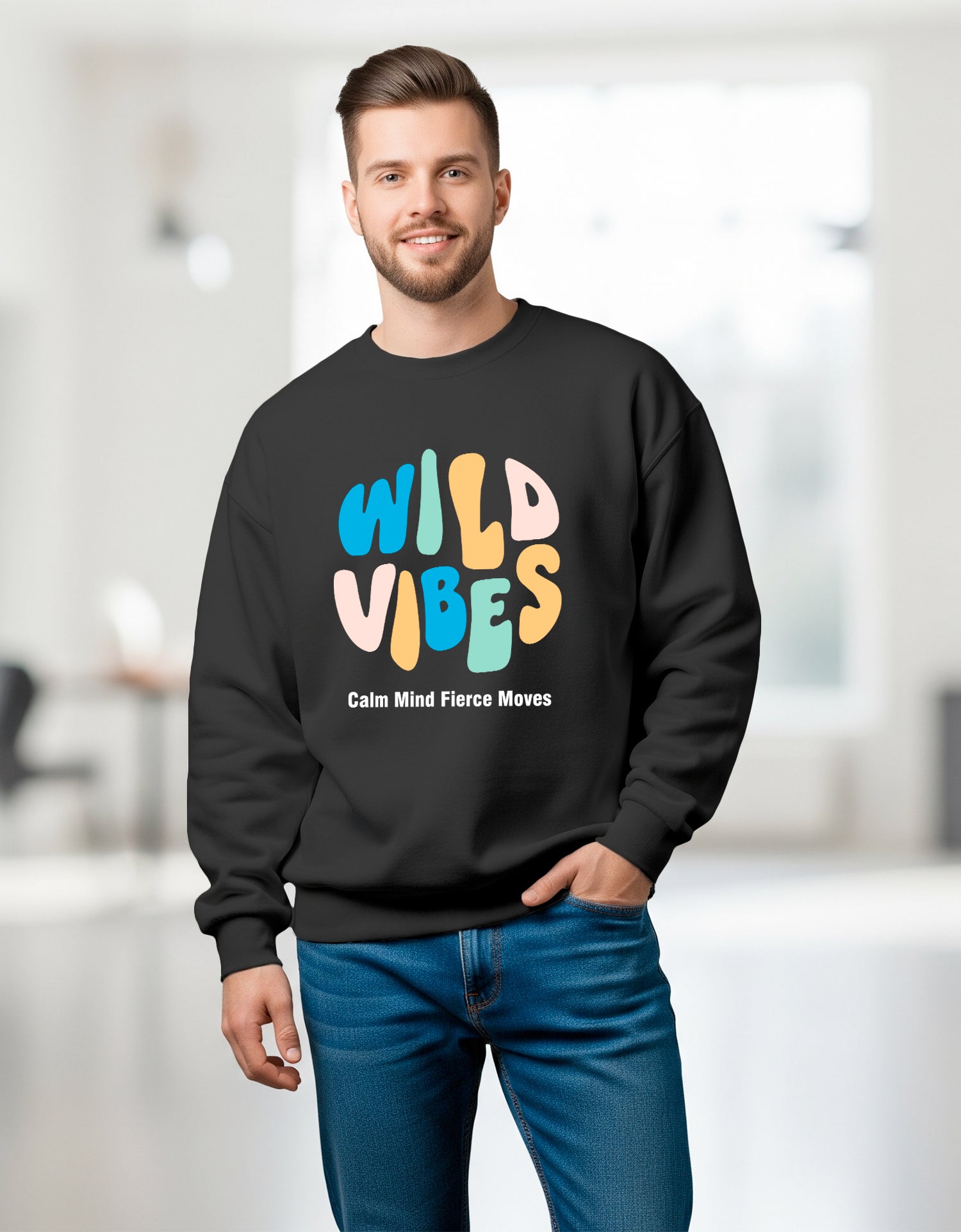 Man wearing a Dumkee Oversize black sweatshirt with 'Wild Vibes' text in colorful letters.