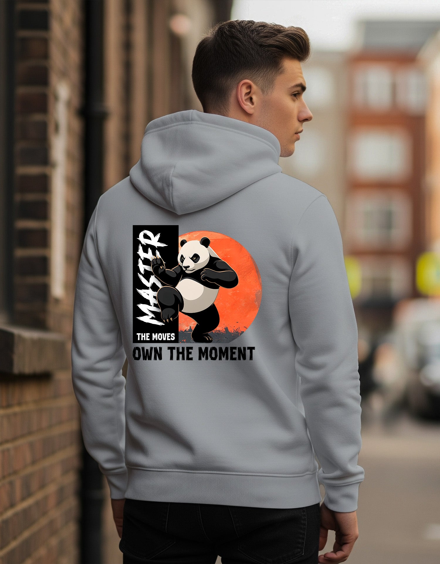 Person wearing a Dumkee Oversize gray hoodie with a panda graphic and text on the back