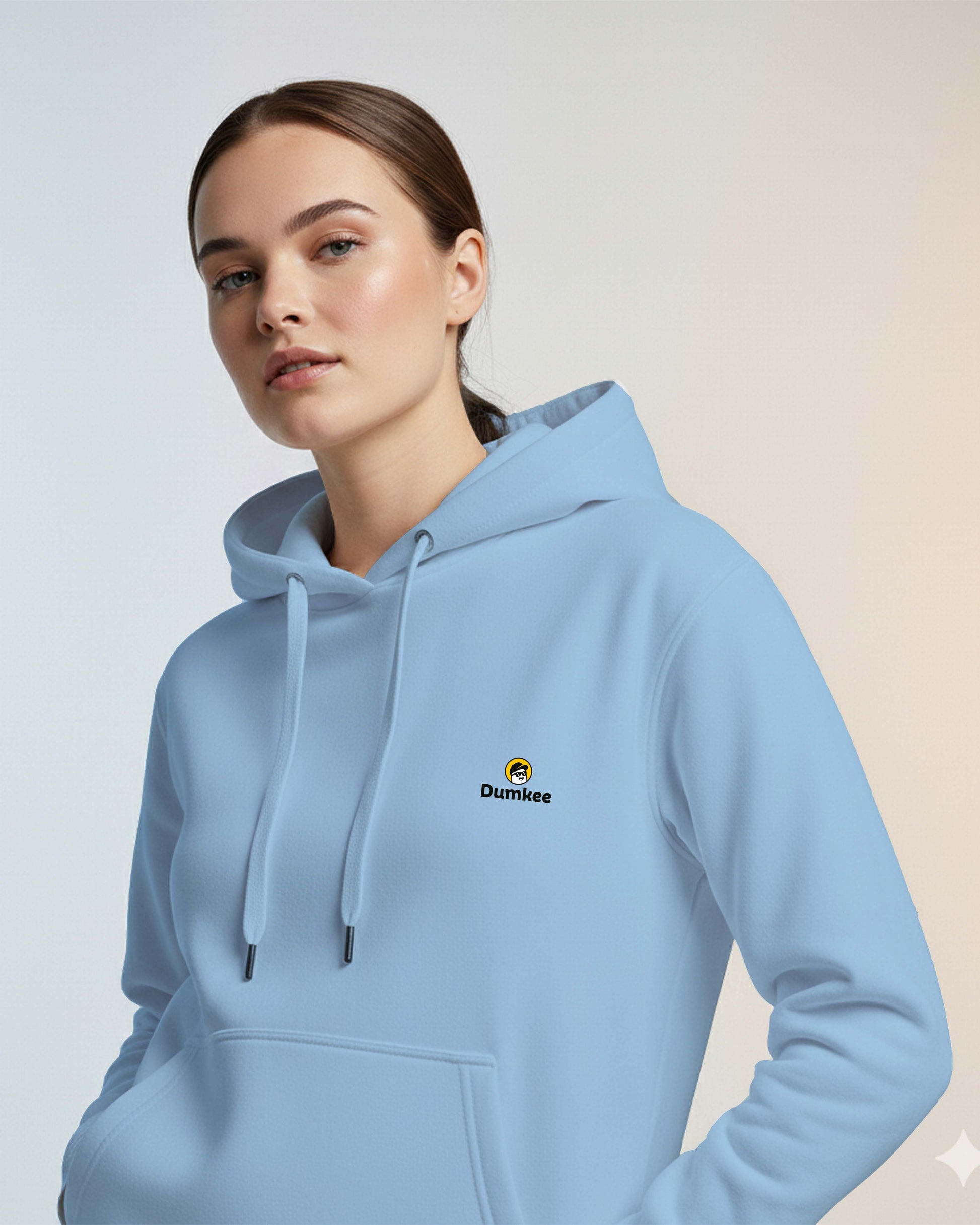 Woman wearing a Dumkee Oversize baby blue hoodie with a Dumkee logo