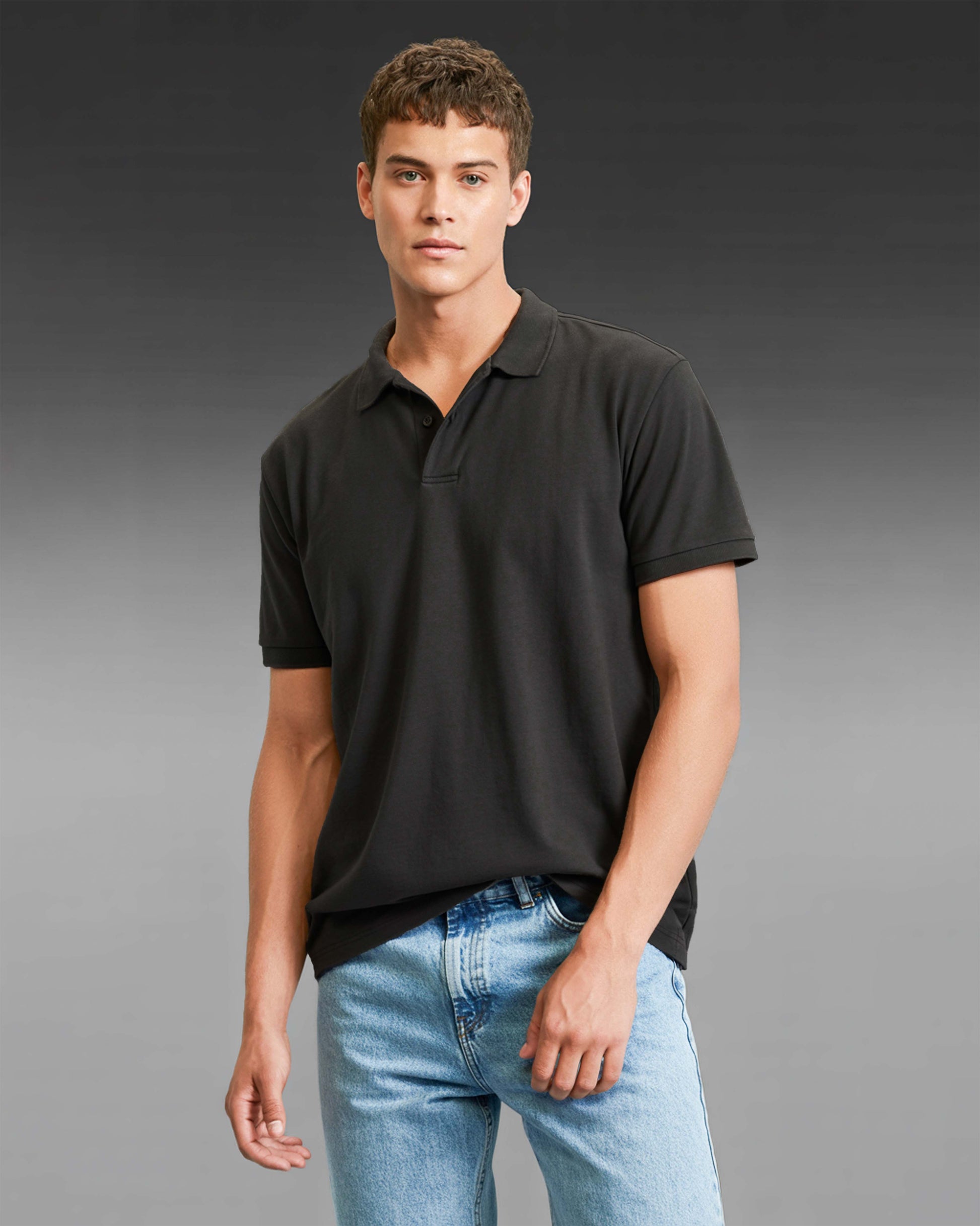 Man wearing a Dumkee black polo shirt