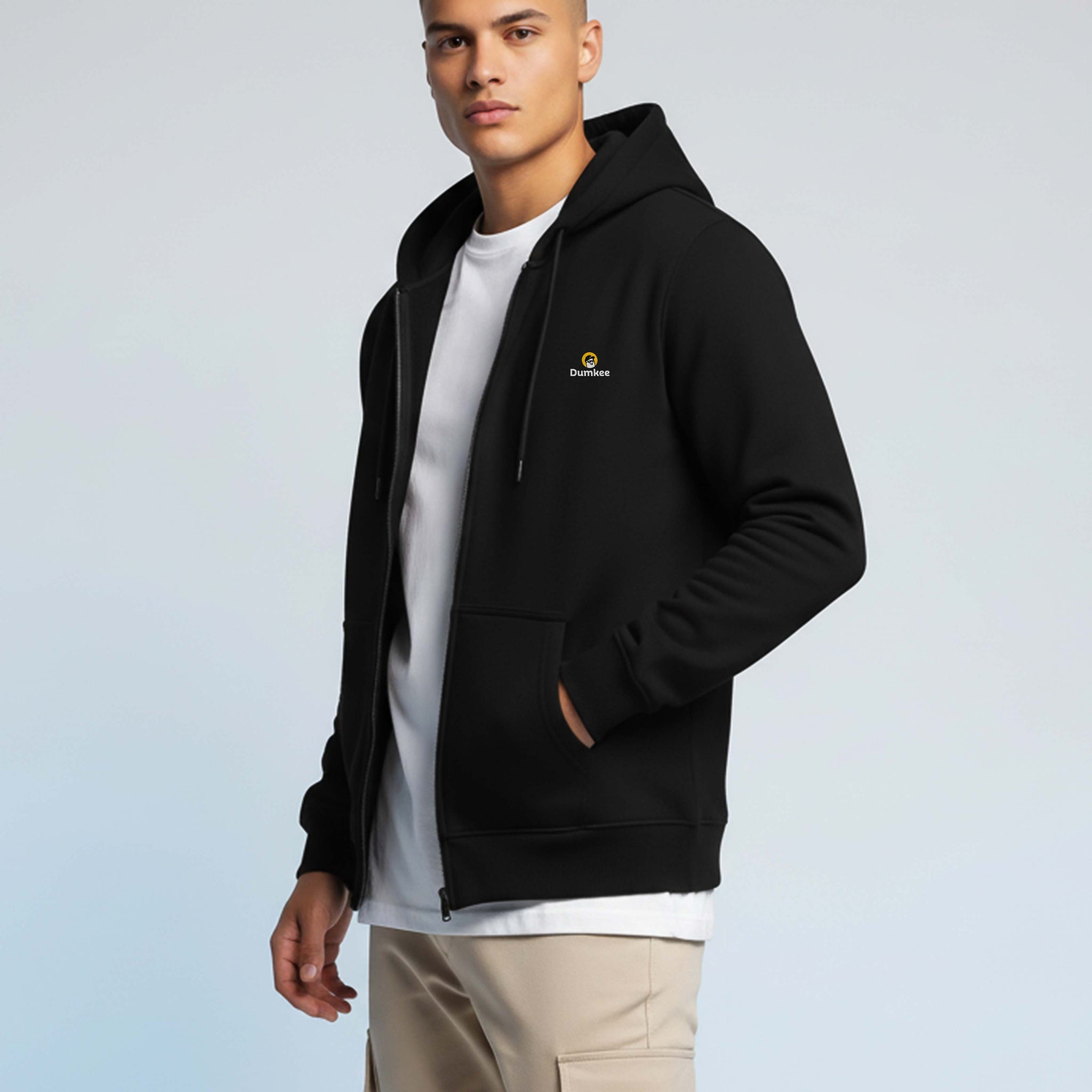 Man wearing a Dumkee black hoodie with a logo.