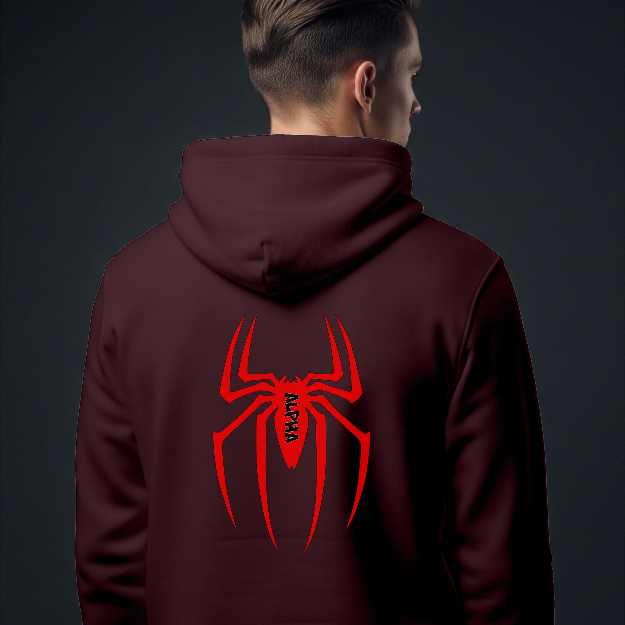 Person wearing a Dumkee maroon hoodie with a red spider logo on the back.
