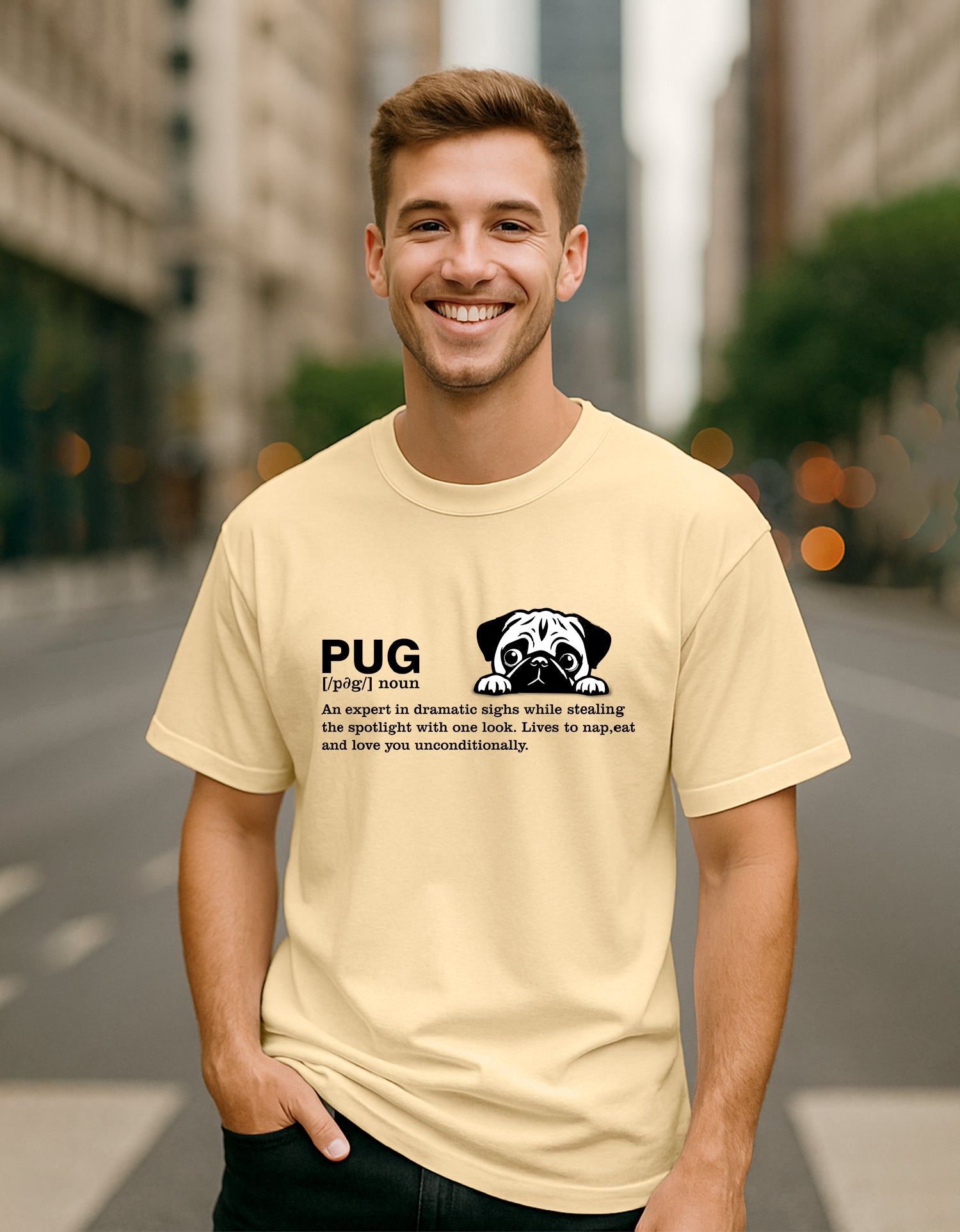 Man wearing a Dumkee beige oversize t-shirt with a pug graphic and text on a city street.