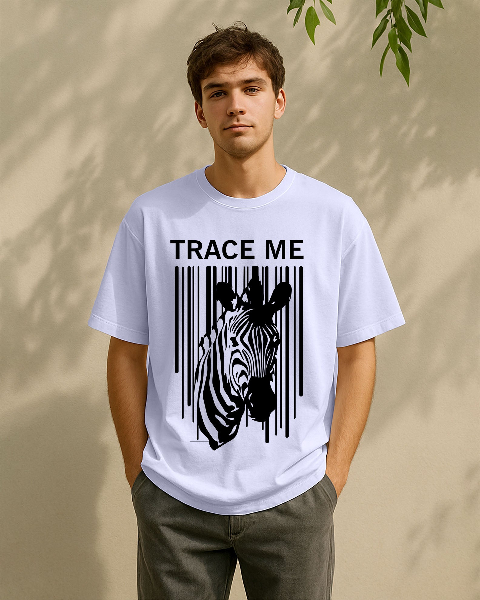 Person wearing a Dumkee Oversize white t-shirt with a zebra graphic and 'TRACE ME' 