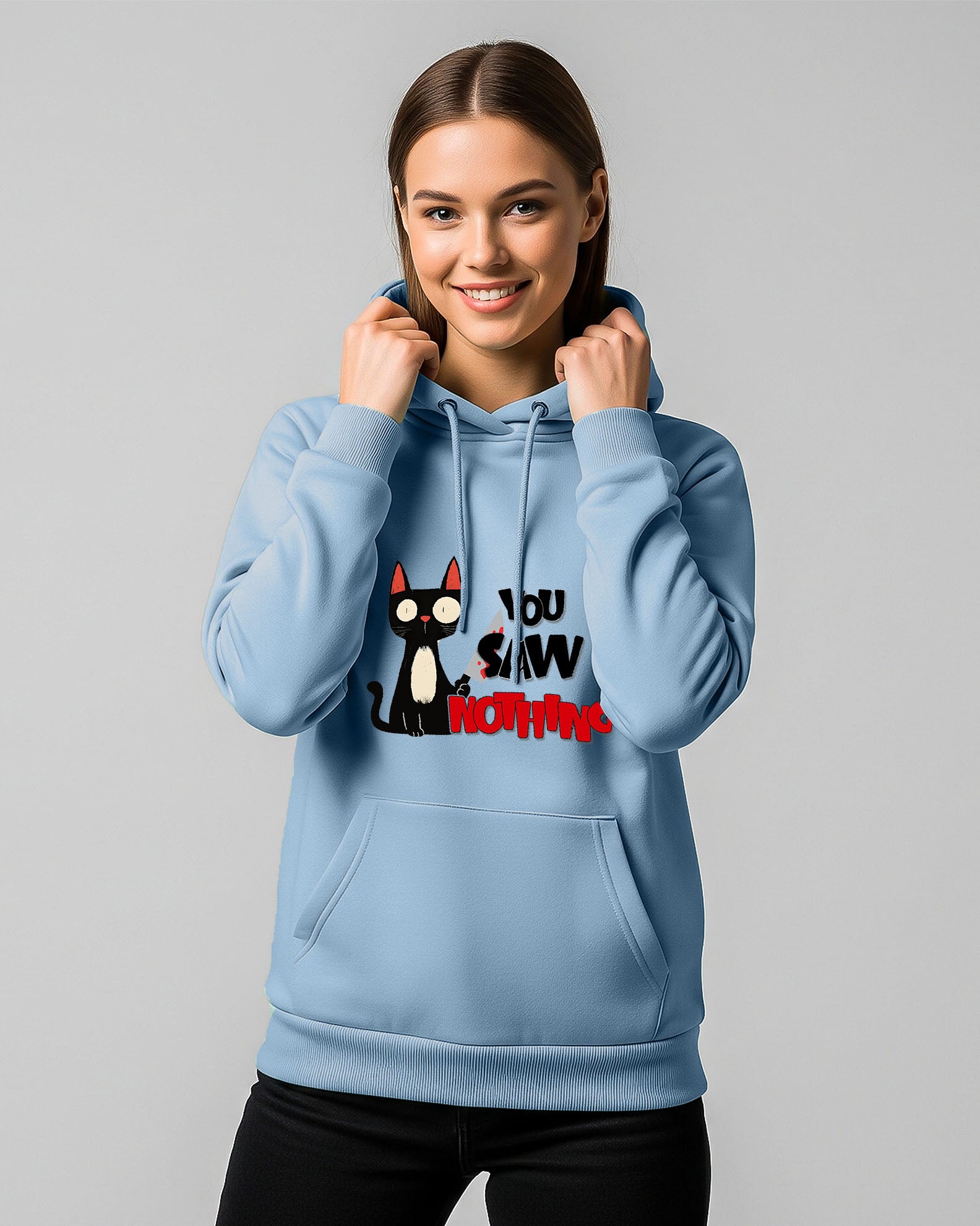 person wearing a baby blue Dumkee hoodie with cat design on it.