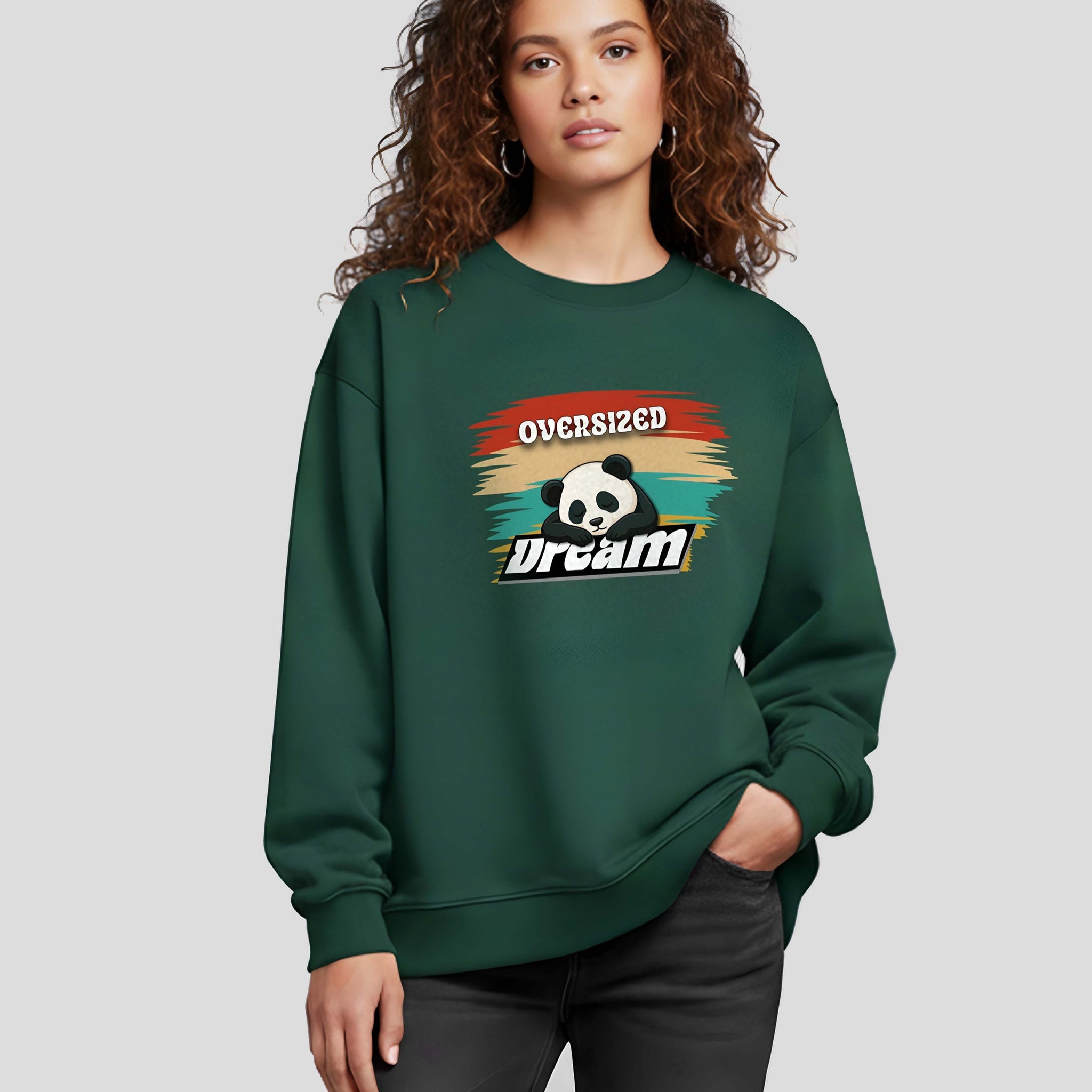 Person wearing a Dumkee Oversize green sweatshirt with a graphic design on a plain background