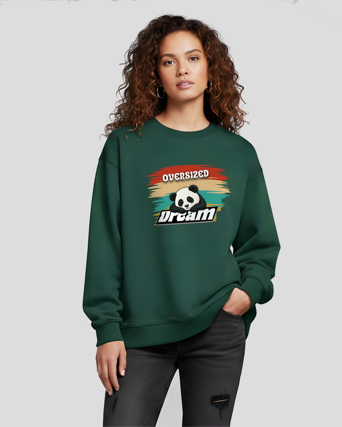 Person wearing a Dumkee Oversize green sweatshirt with a graphic design on a plain background