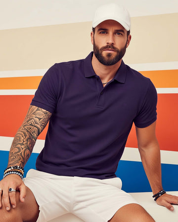 Man wearing a Dumkee  purple polo shirt and white cap
