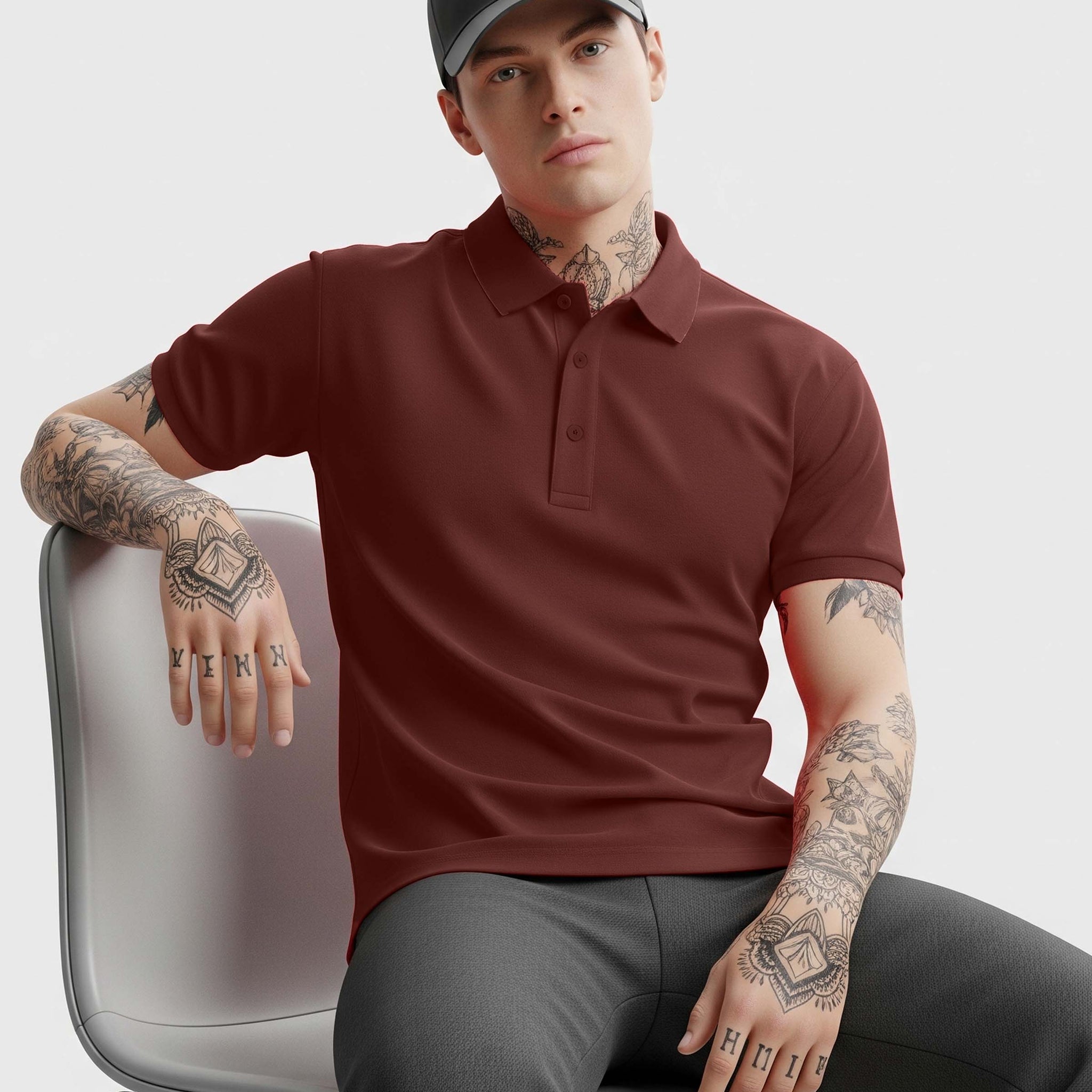 Man wearing a Dumkee Brick Red polo shirt and gray cap