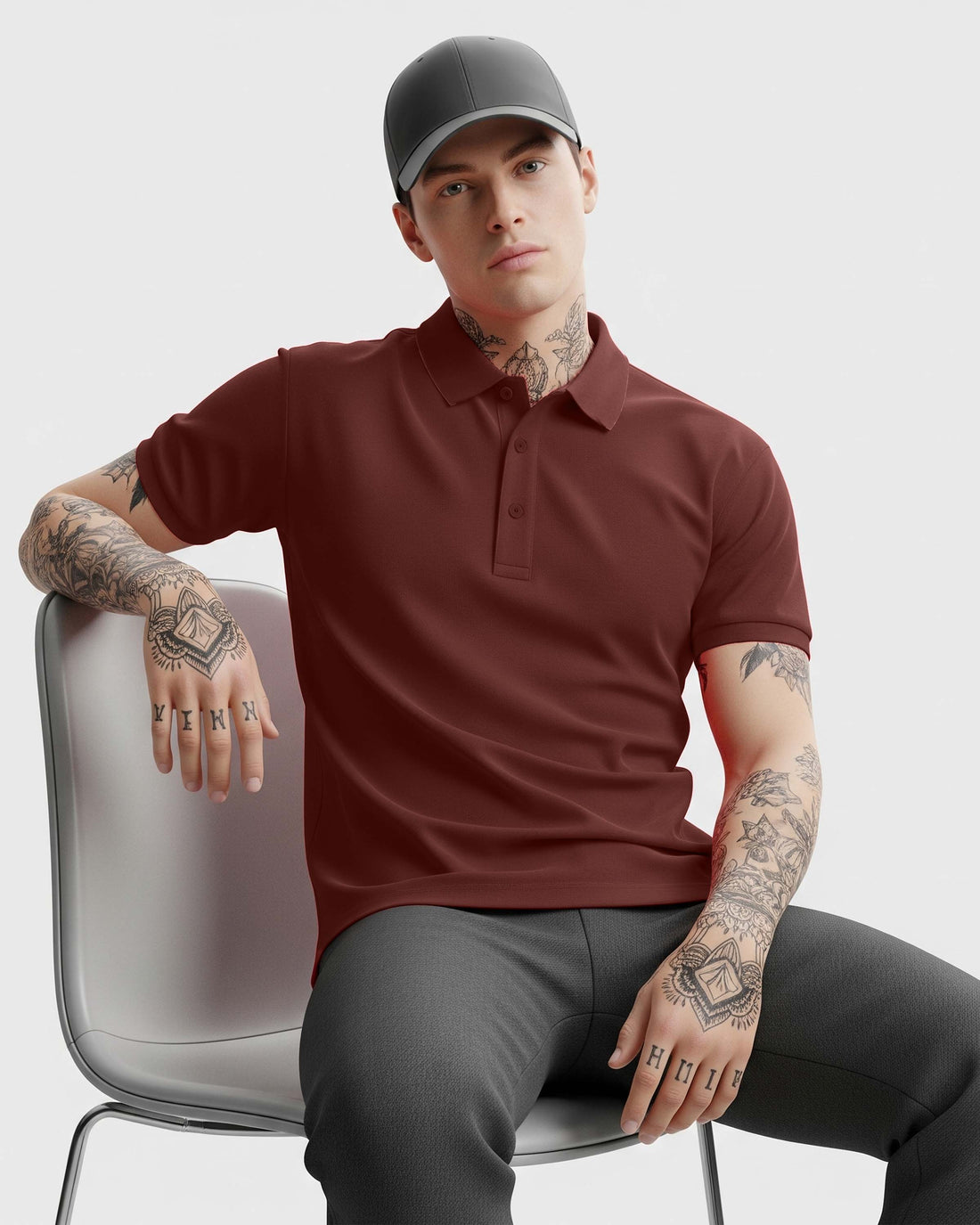 Man wearing a Dumkee Brick Red polo shirt and gray cap