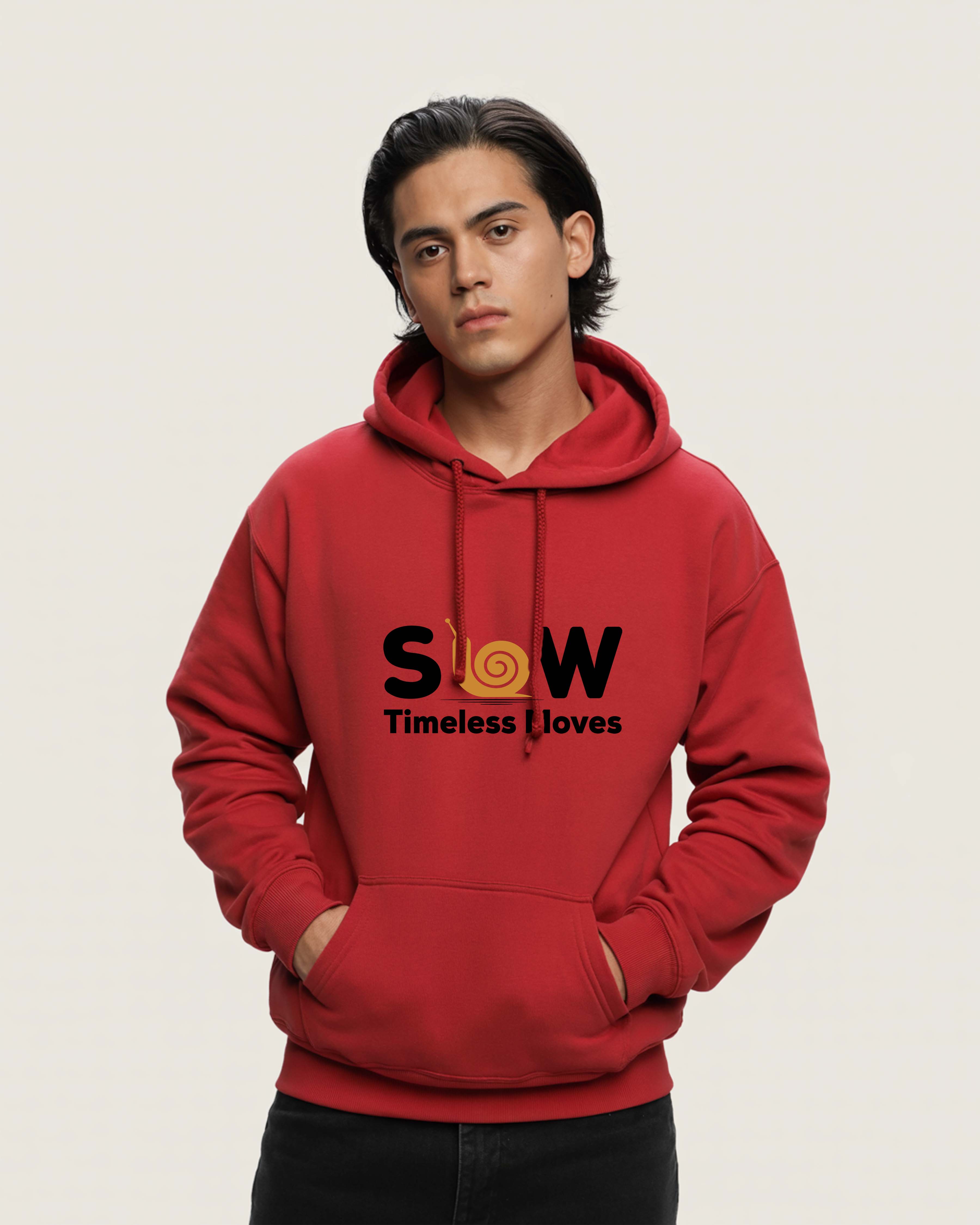 Person wearing a Dumkee Oversize red hoodie with 'SLOW Timeless Loves' text on a beige background
