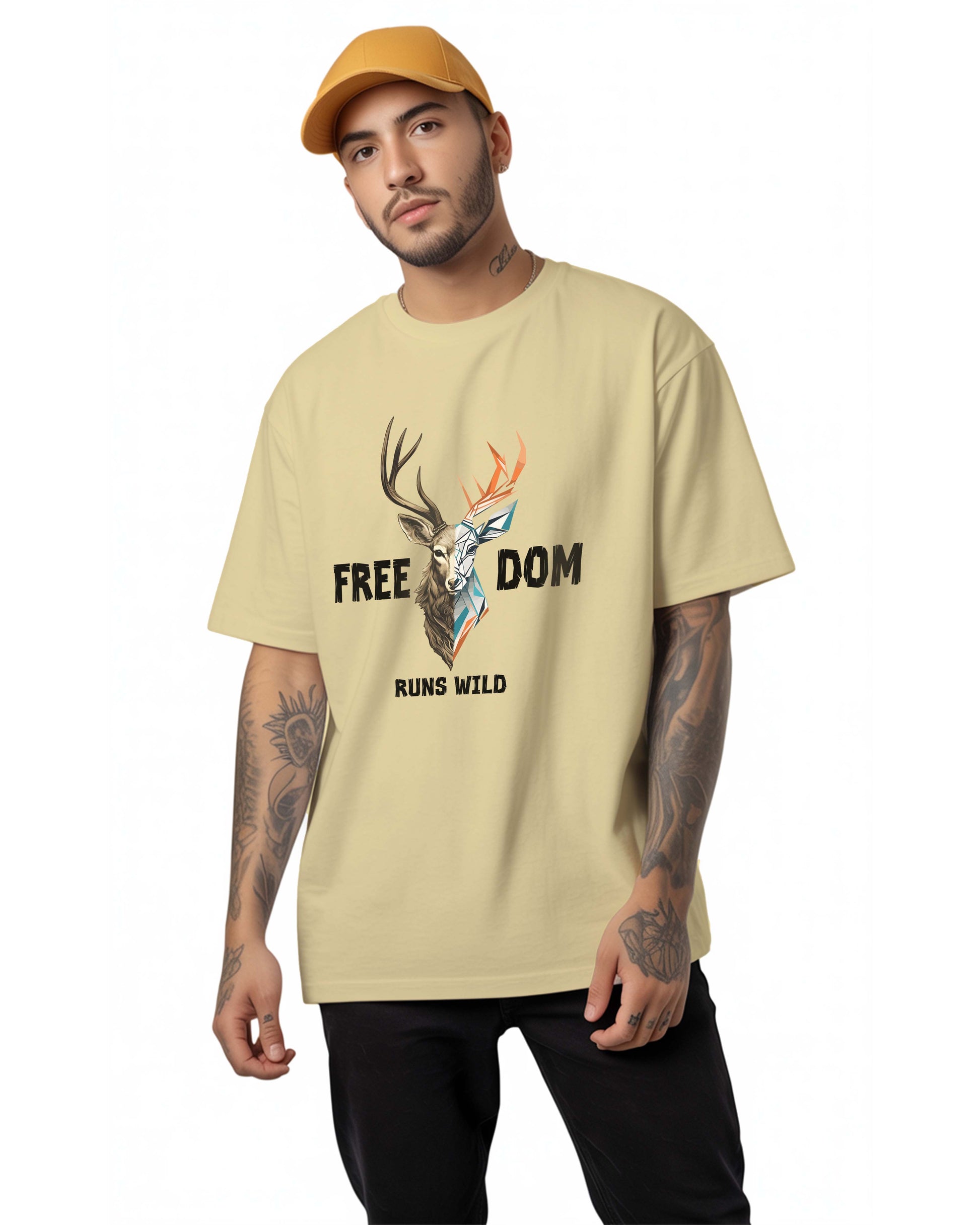 Man wearing a Dumkee beige oversize t-shirt with a graphic design and text on a white background